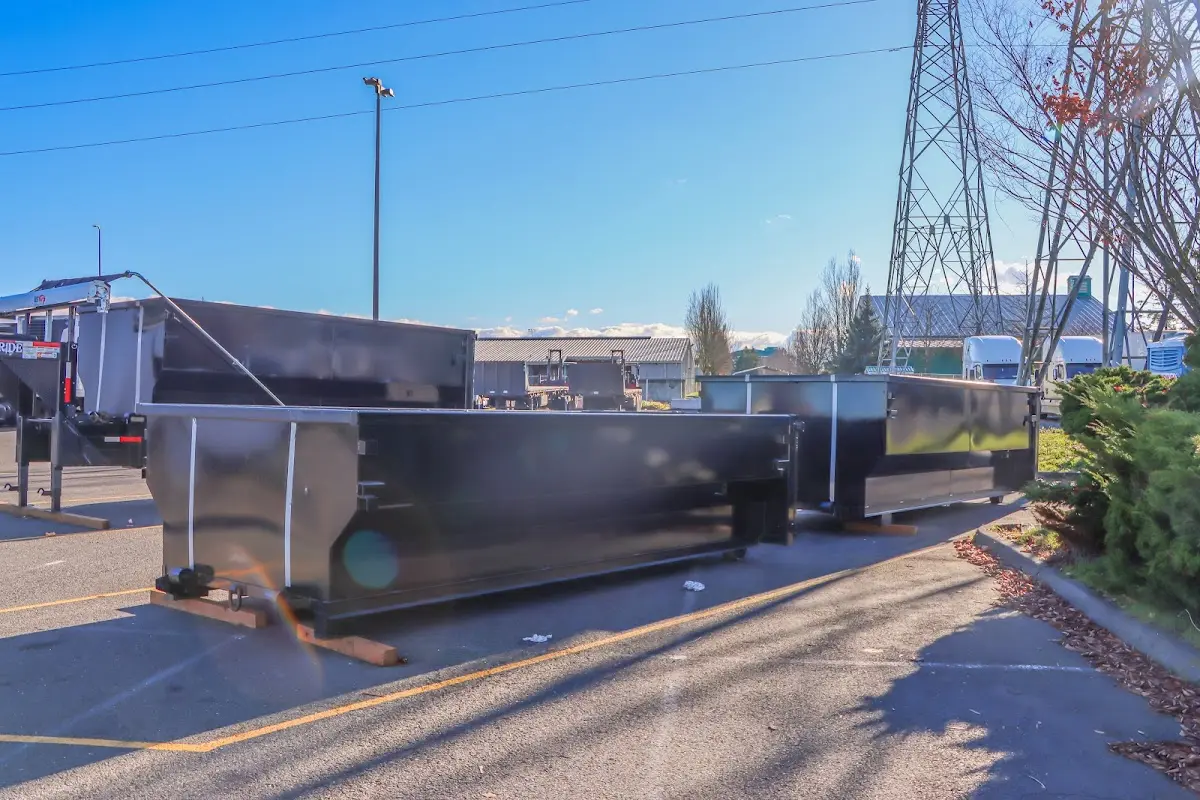Roll-off dumpster ready for waste disposal at job site for 12 Yard Dumpster Rental in Clifton Heights